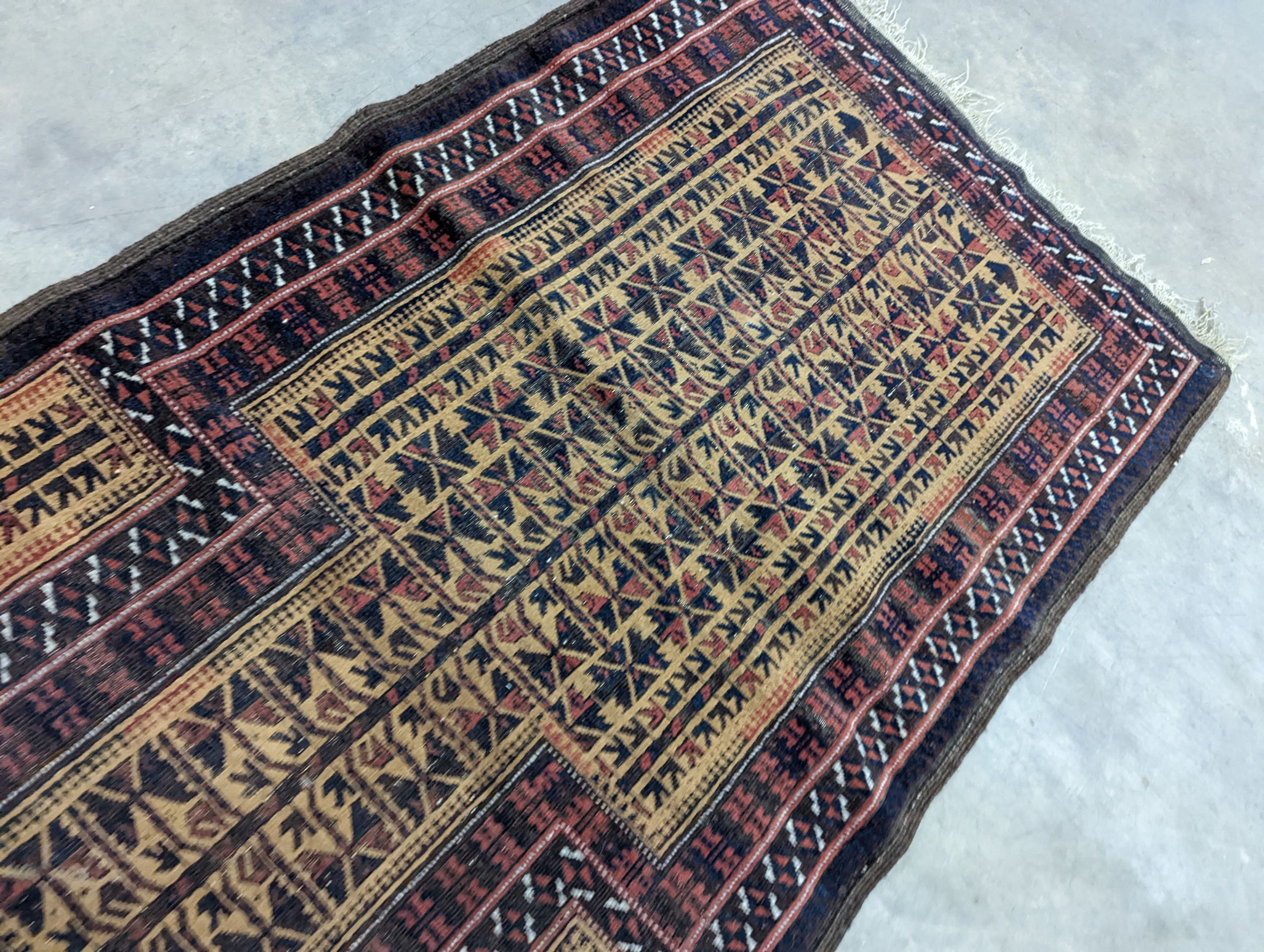 A Belouch geometric prayer rug and two Caucasian design rugs, largest 152 x 104cm
